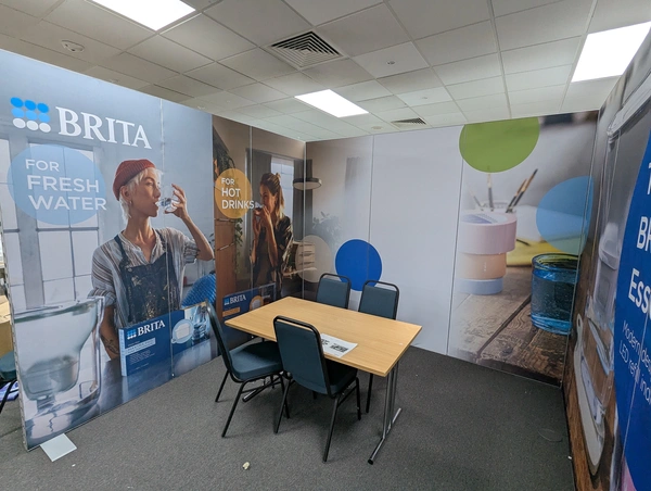 a small trade show stand made from aluvision modular frames with silicone-edge prints showcasing the brand Brita water filters