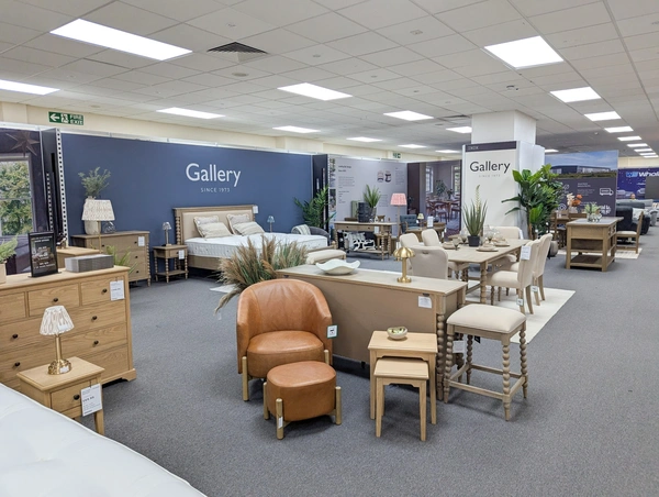 a large exhibition stand with 29m of wall at the back and a range of furniture in front.